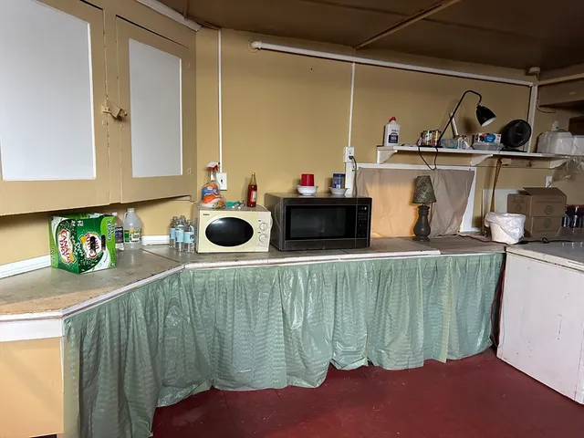 a kitchen with a sink and a stove