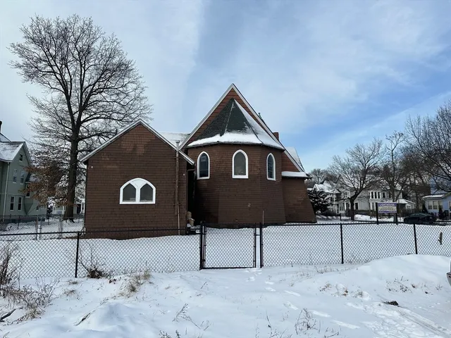 a house with trees in the background