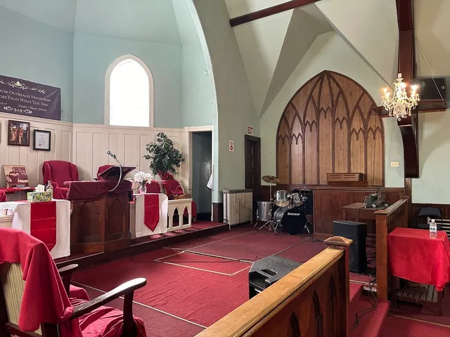 a room with furniture and musical instruments