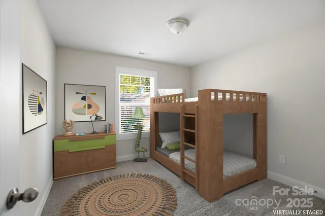 a bedroom with furniture and a window