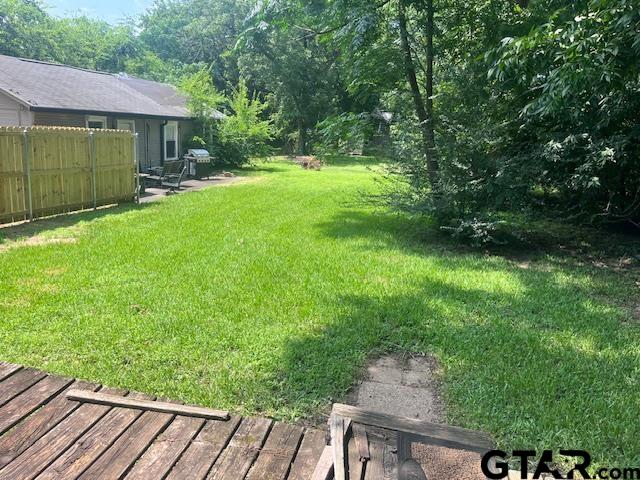617 West Dobbs Street Tyler, TX 75701 - Photo 18 of 19 a view of a house with a backyard