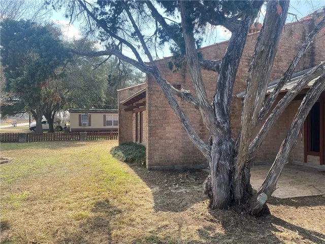 a view of a swimming pool with a yard
