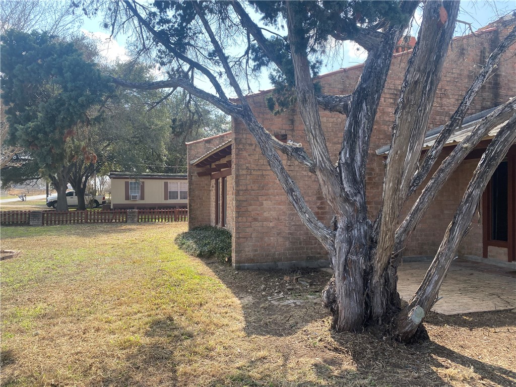 5335 East Riverview Street Robstown, TX 78380 - Photo 14 of 17 a view of a house with snow on a tree