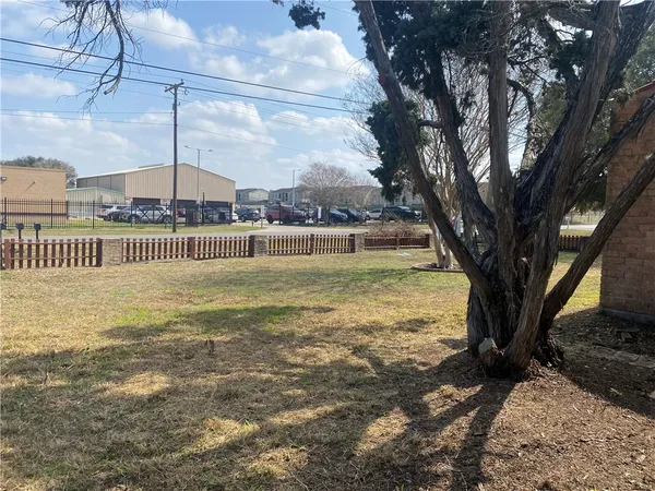 a view of a livingroom with wooden floor and a ceiling fan