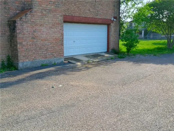 a view of a house with a street