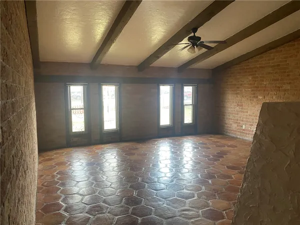 a view of hallway with stairs and a chandelier