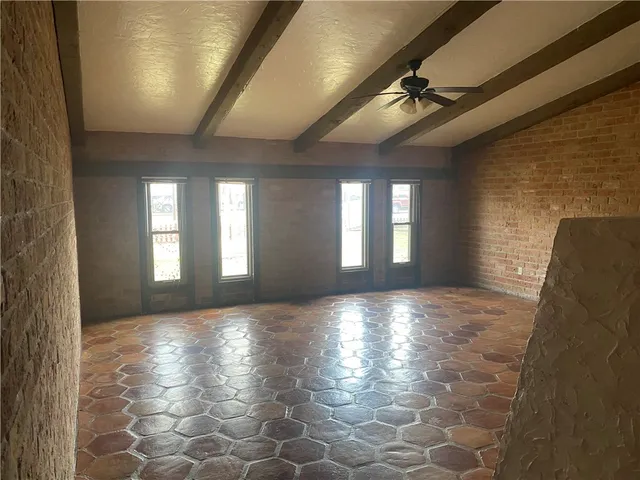 a view of hallway with stairs and a chandelier