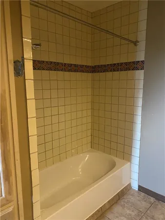 a bathroom with a granite countertop sink a toilet and a mirror