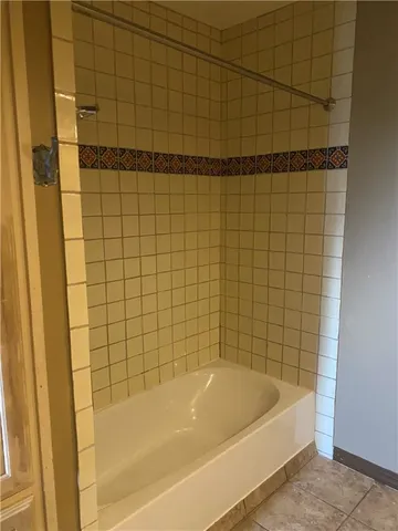 a bathroom with a granite countertop sink a toilet and a mirror