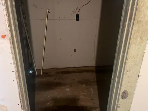 a white toilet sitting next to a sink