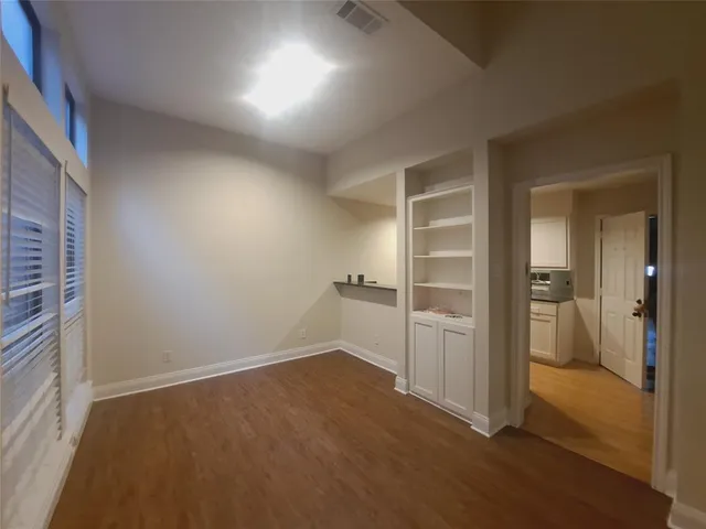 a view of an empty room and closet