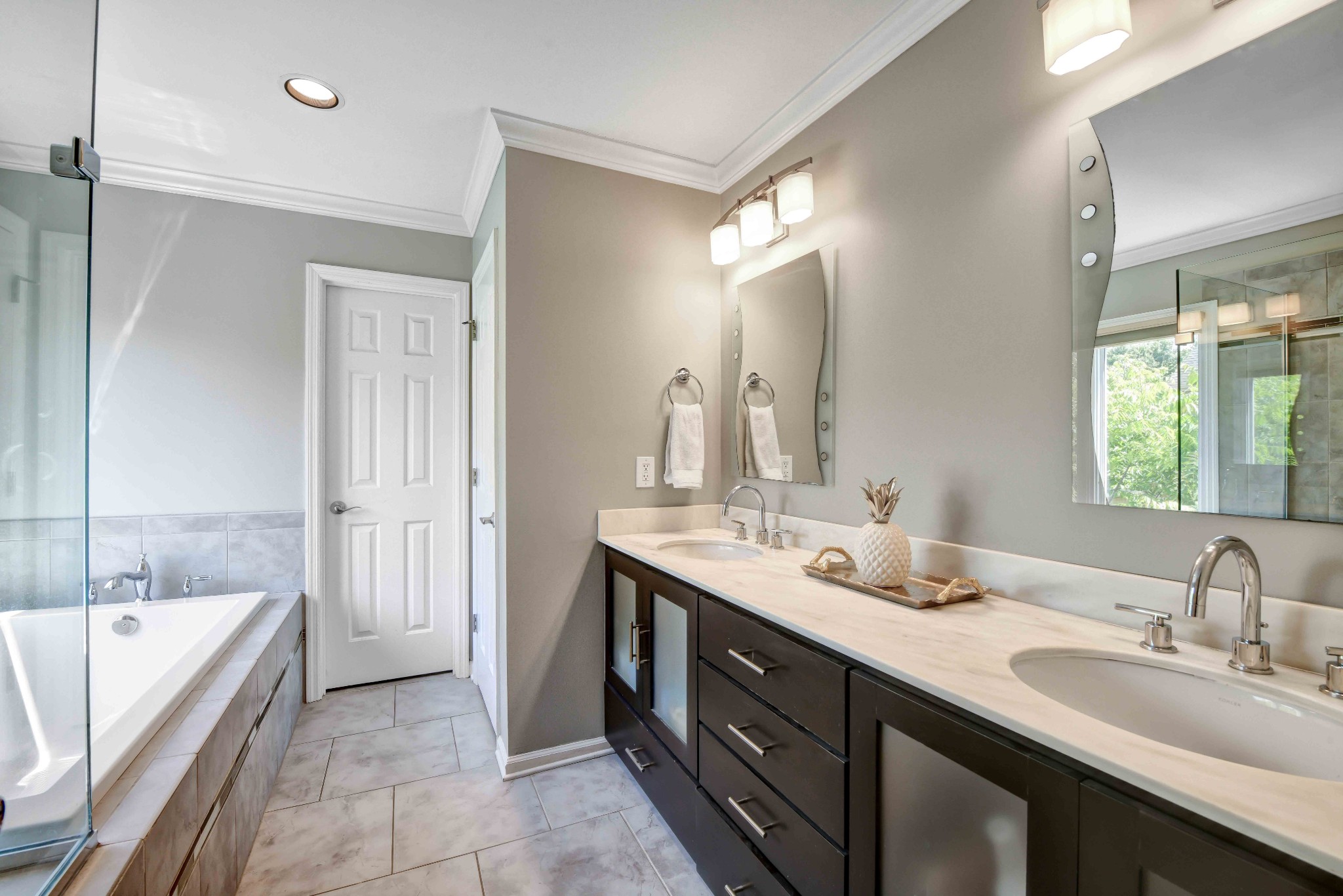 4845 Manassas Drive Brentwood, TN 37027 - Photo 14 of 22 a bathroom with a tub double vanity sink and mirror