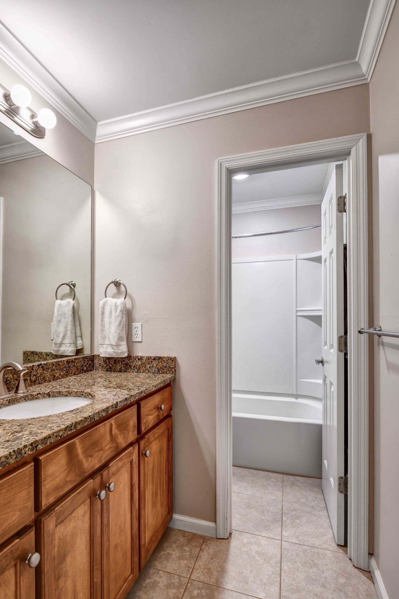 4845 Manassas Drive Brentwood, TN 37027 - Photo 17 of 22 a bathroom with a granite countertop sink and a mirror