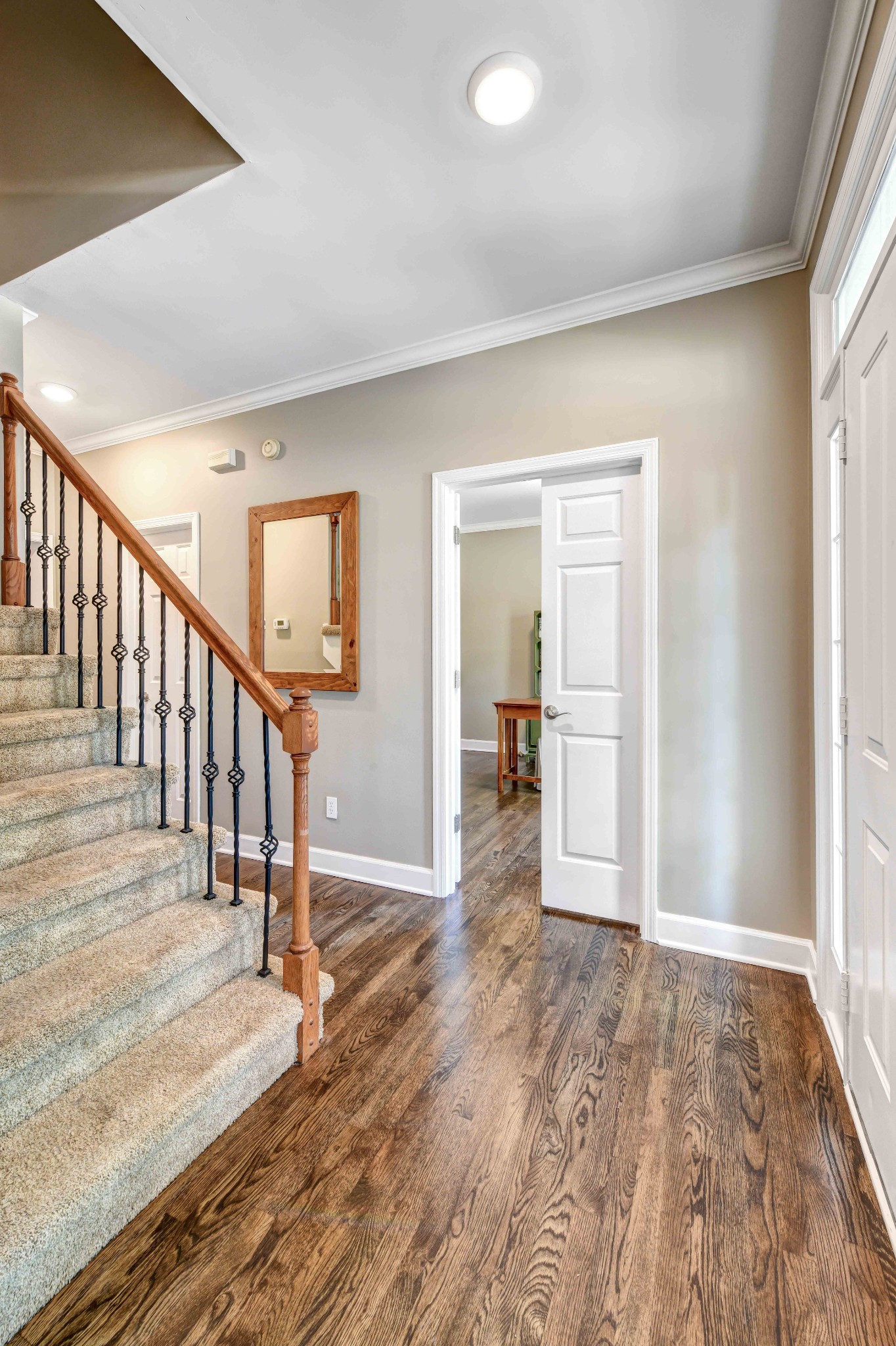 4845 Manassas Drive Brentwood, TN 37027 - Photo 3 of 22 a view of a hallway with wooden floor and entryway