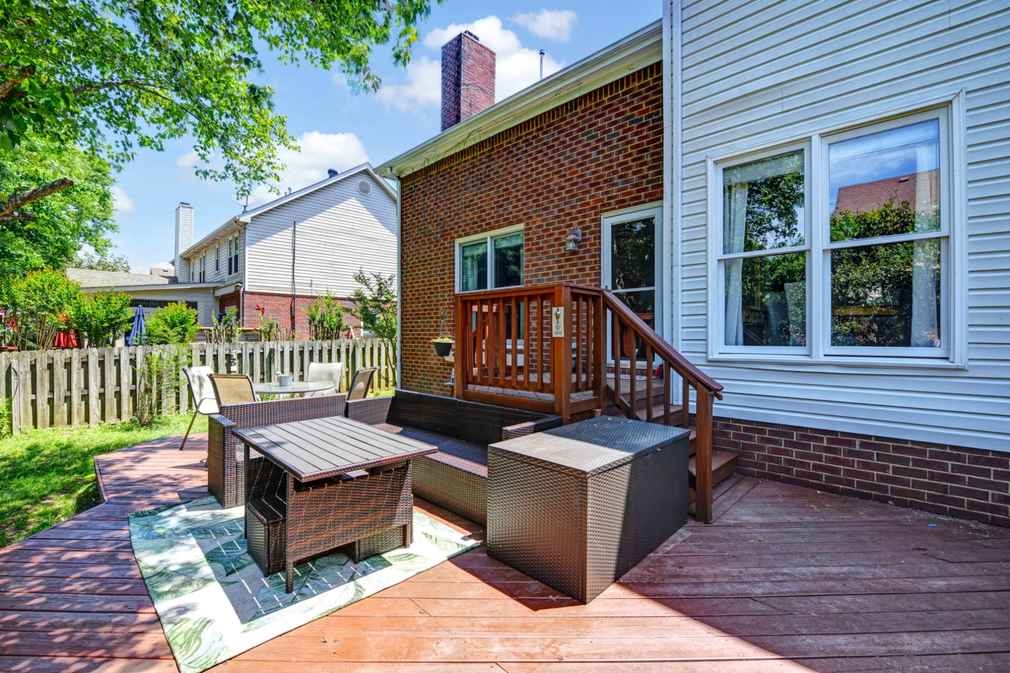 4845 Manassas Drive Brentwood, TN 37027 - Photo 21 of 22 a view of a deck with couches and wooden floor