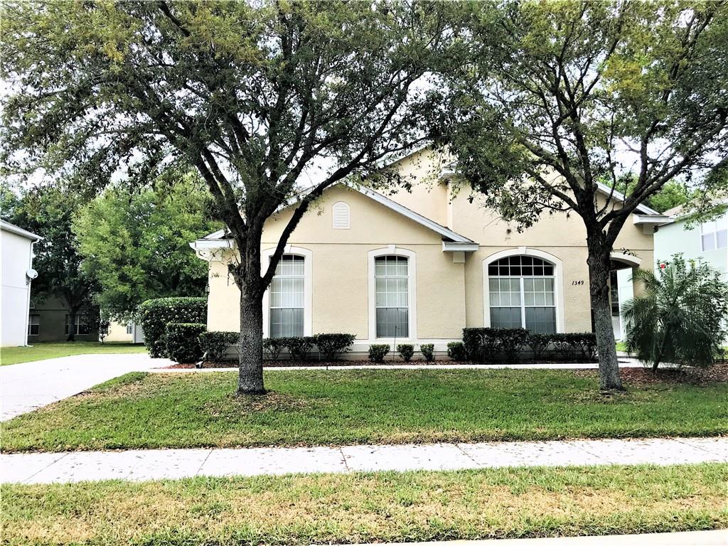 1349 Kintla Road Apopka, FL 32712 - Photo 1 of 1 a front view of a house with a yard
