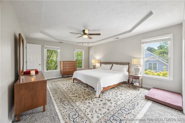 a view of a backyard with large trees