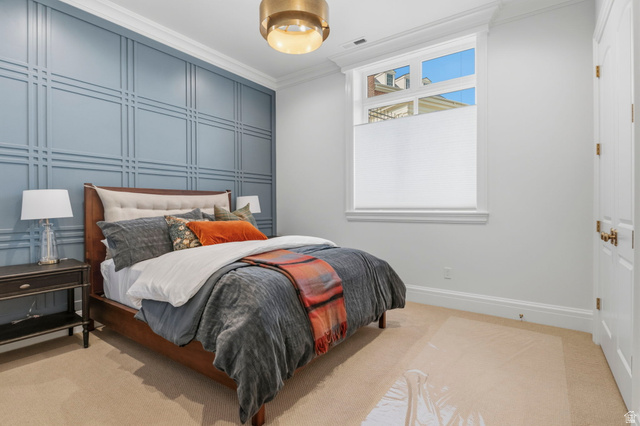 115 East Hidden Ridge Lane, Unit 42 Mapleton, UT 84664 - Photo 74 of 103 Accent wall with grid paneling, crown molding, white trim, recessed window with cellular shade, and a flush mount light fixture