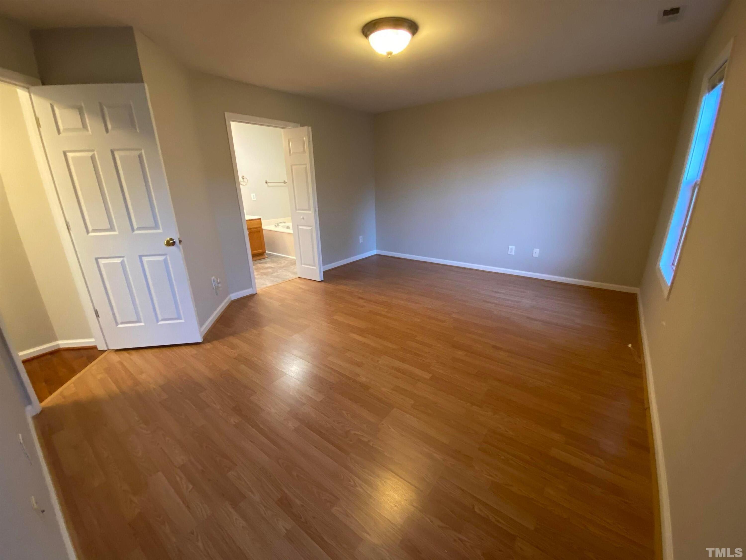 2413 Wellington Ridge Loop, Unit 2413 Cary, NC 27518 - Photo 27 of 30 a view of empty room with wooden floor