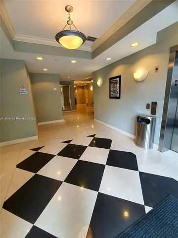 a bathroom with a black and white checkered floor