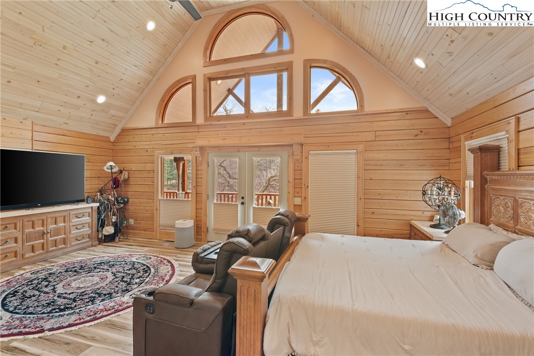 262 Lemly Road Fleetwood, NC 28626 - Photo 13 of 37 a bedroom with a bed and a flat screen tv