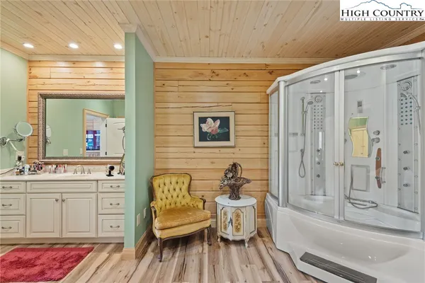 a spacious bathroom with a bathtub and a sink
