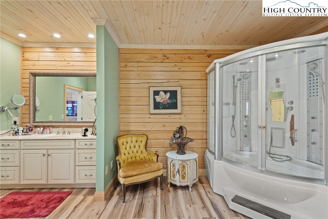 262 Lemly Road Fleetwood, NC 28626 - Photo 14 of 37 a spacious bathroom with a bathtub and a sink
