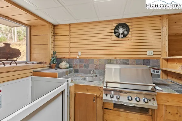 a kitchen with a stove and a sink