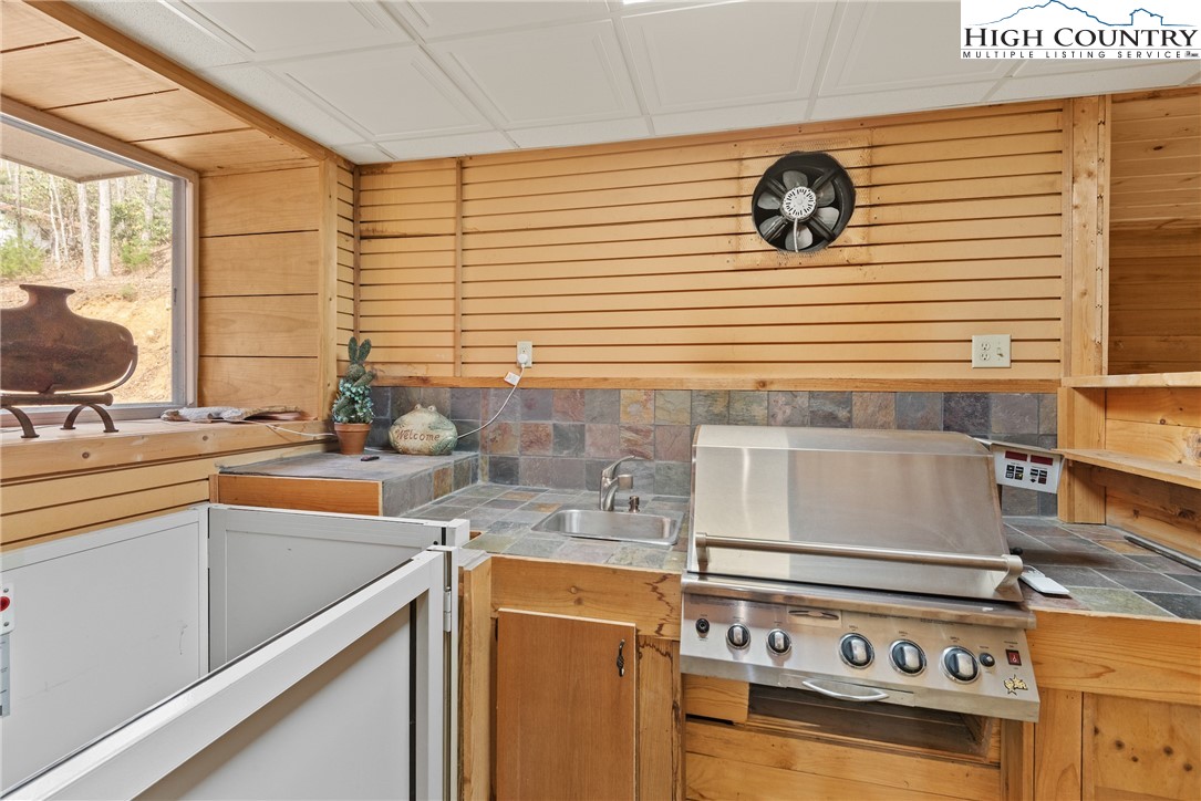 262 Lemly Road Fleetwood, NC 28626 - Photo 15 of 37 a kitchen with a stove and a sink