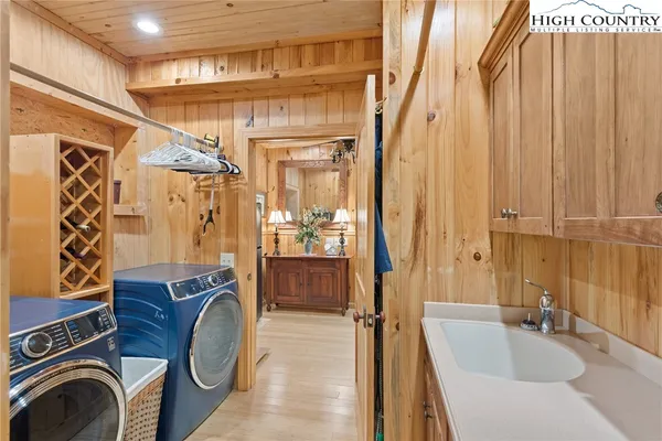 a bathroom with a sink a mirror and shower