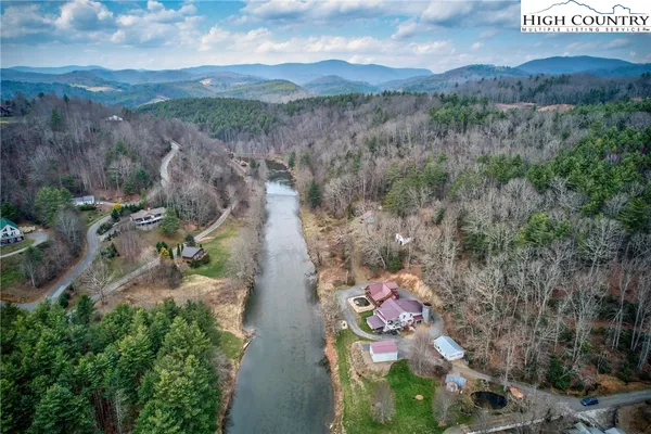 an aerial view of a house with yard