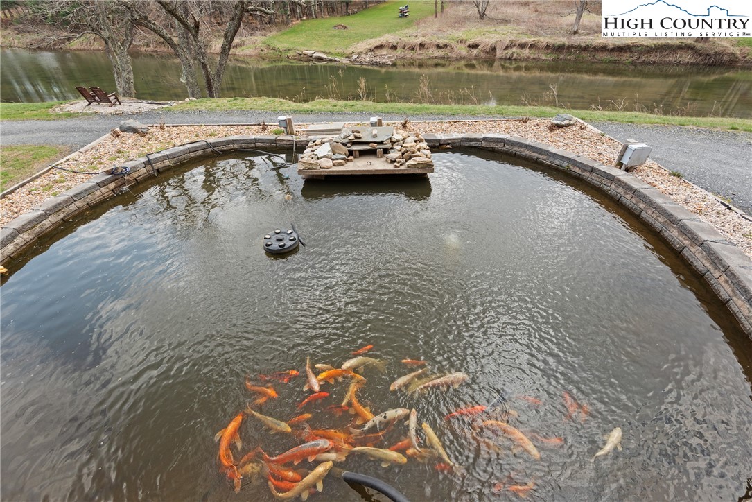 262 Lemly Road Fleetwood, NC 28626 - Photo 4 of 37 a view of a lake with outdoor space