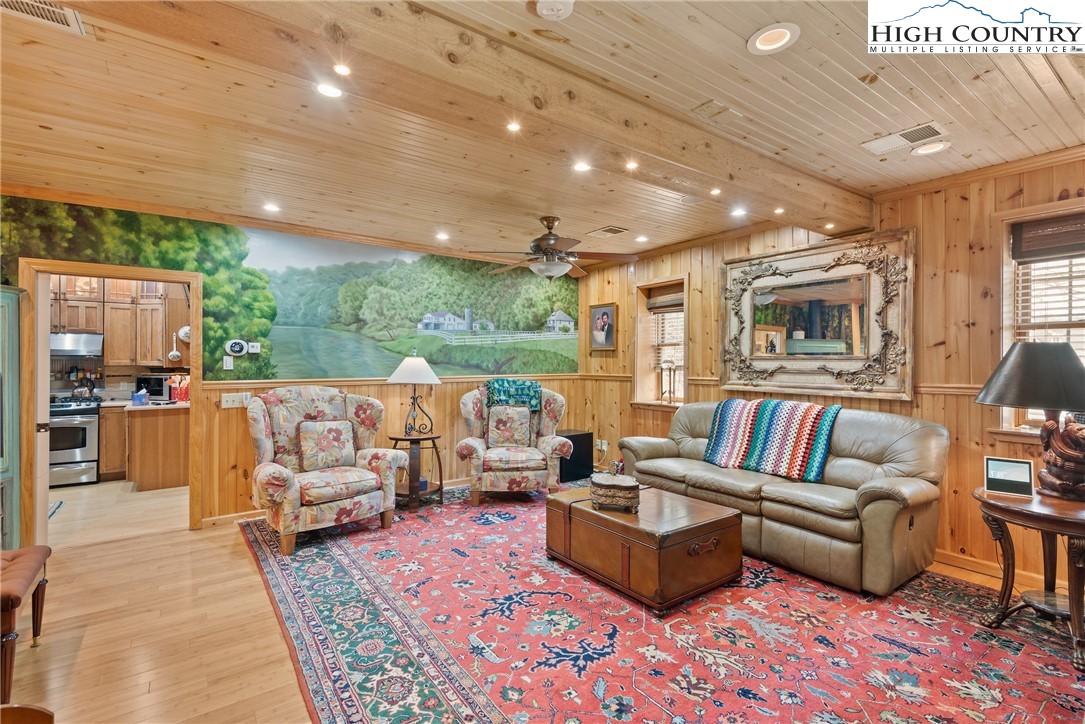 262 Lemly Road Fleetwood, NC 28626 - Photo 10 of 37 a living room with furniture and a open kitchen view