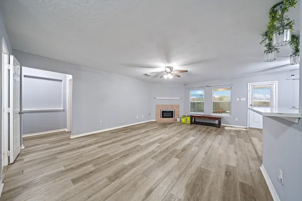 a view of livingroom with hardwood floor and a ceiling fan