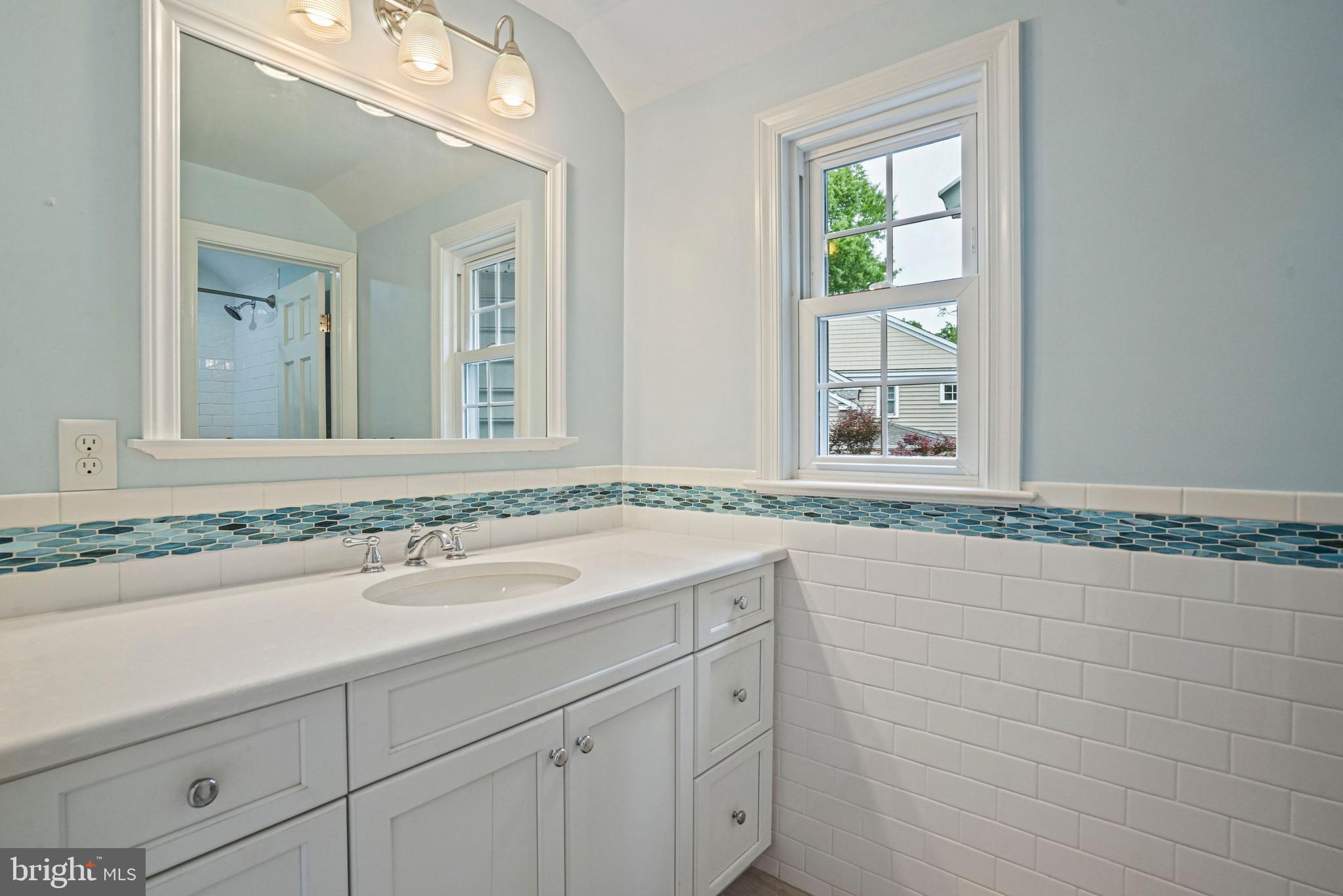 1907 Brisbane Street Silver Spring, MD 20902 - Photo 30 of 39 a bathroom with a sink and a mirror