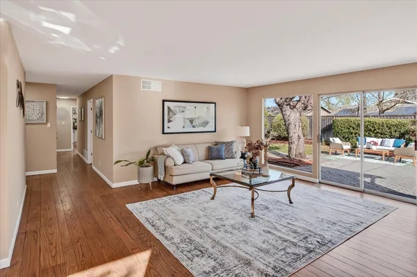 a living room with furniture and a rug