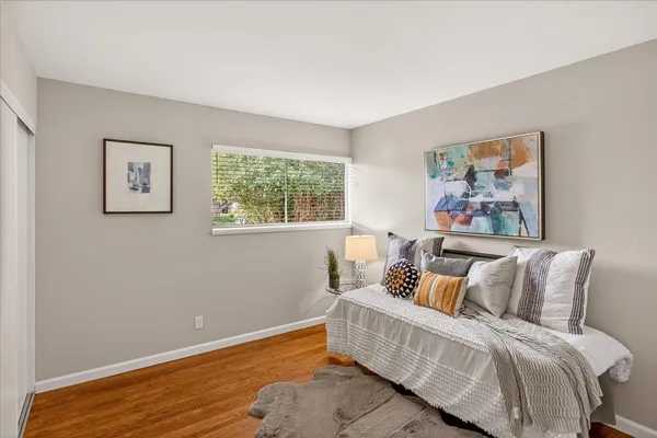 a bed room with a bed and a window