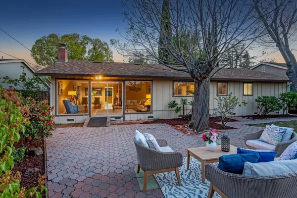 a outdoor space with patio furniture and potted plants