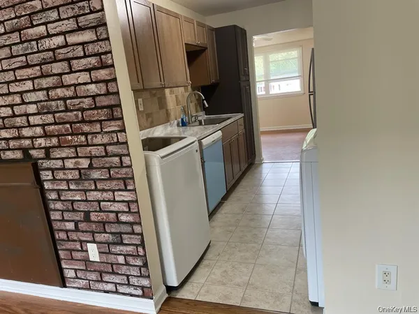 a kitchen with a sink and a stove top oven