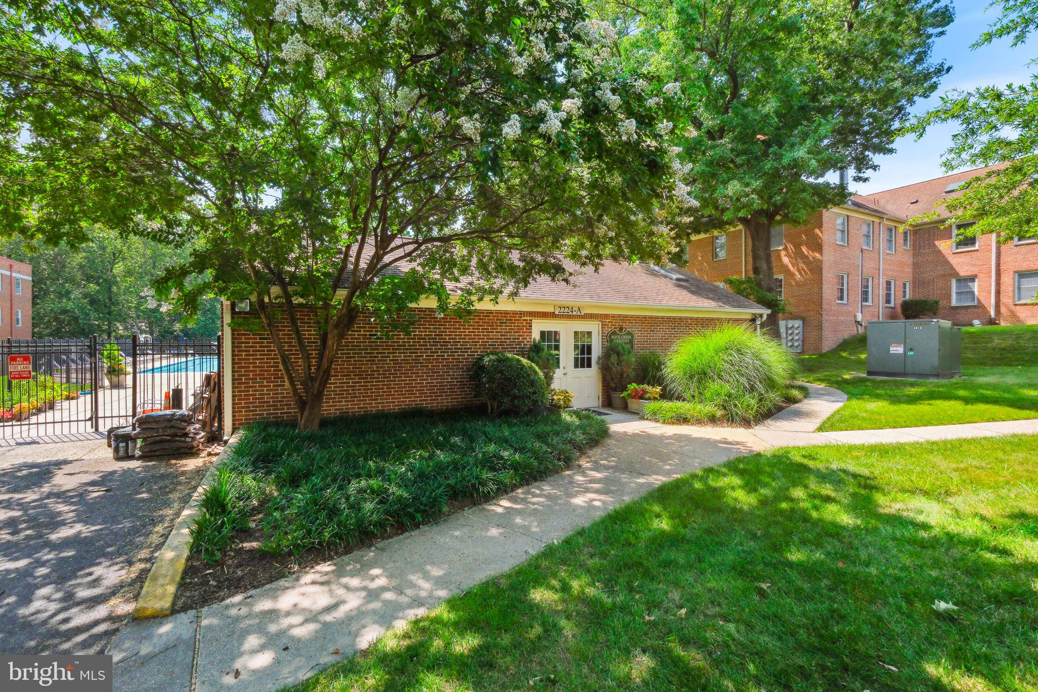 8203 Grubb Road, Unit 201 Silver Spring, MD 20910 - Photo 20 of 26 a front view of a house with garden