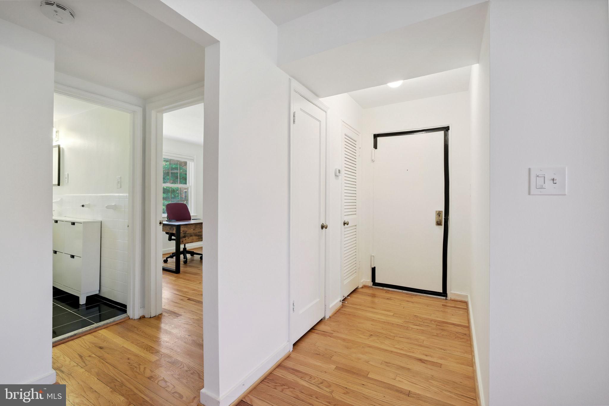 8203 Grubb Road, Unit 201 Silver Spring, MD 20910 - Photo 3 of 26 wooden floor with closet