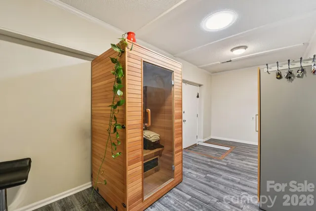 a view of a patio with a table and chairs and potted plants