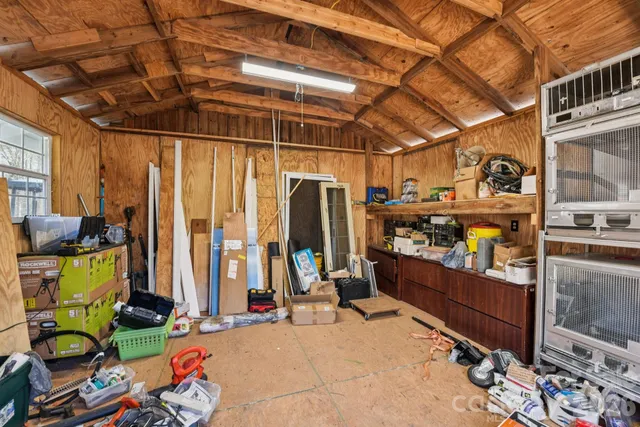 a view of large pool with large trees