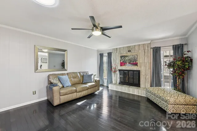 a living room with furniture and a flat screen tv