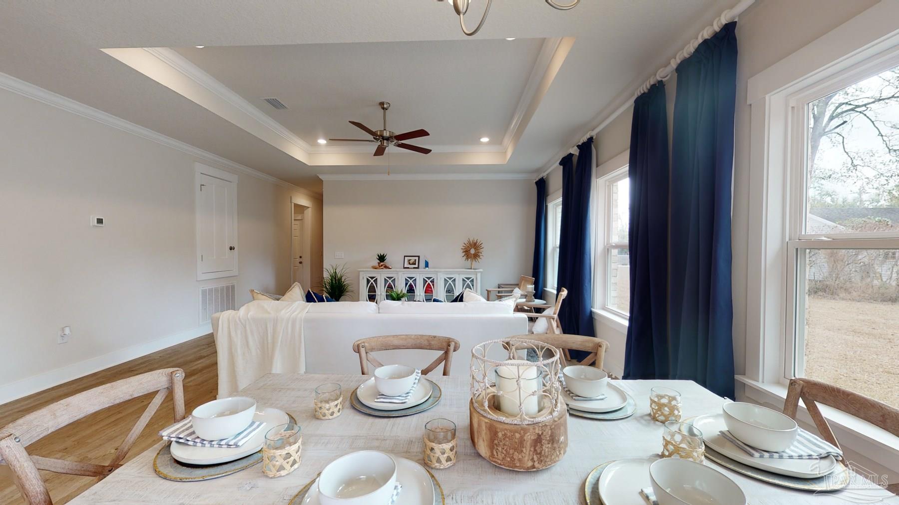 4531 Jude Way Pace, FL 32571 - Photo 11 of 43 a kitchen with a table and chairs in it