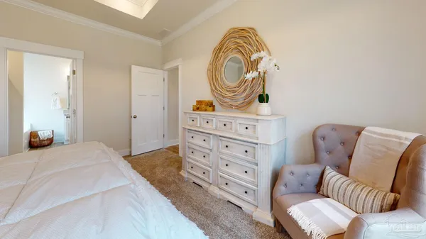 a bedroom with a bed and couch