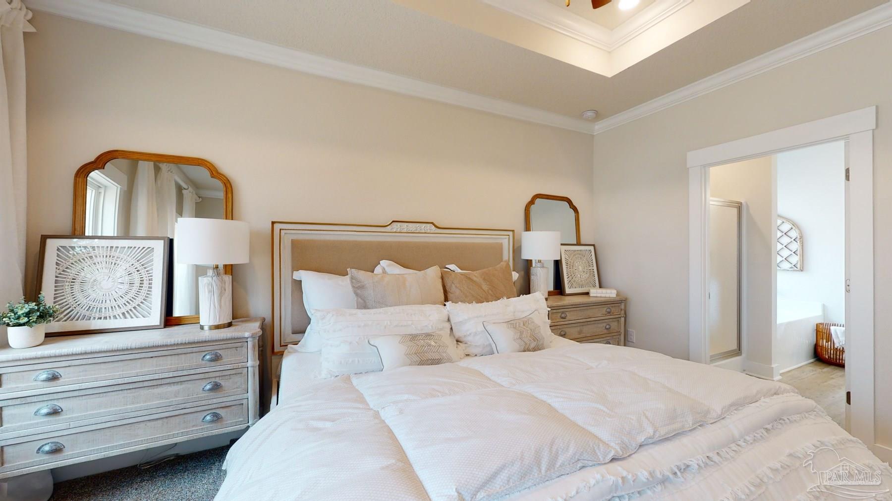 4531 Jude Way Pace, FL 32571 - Photo 22 of 43 a bedroom with a bed and a potted plant