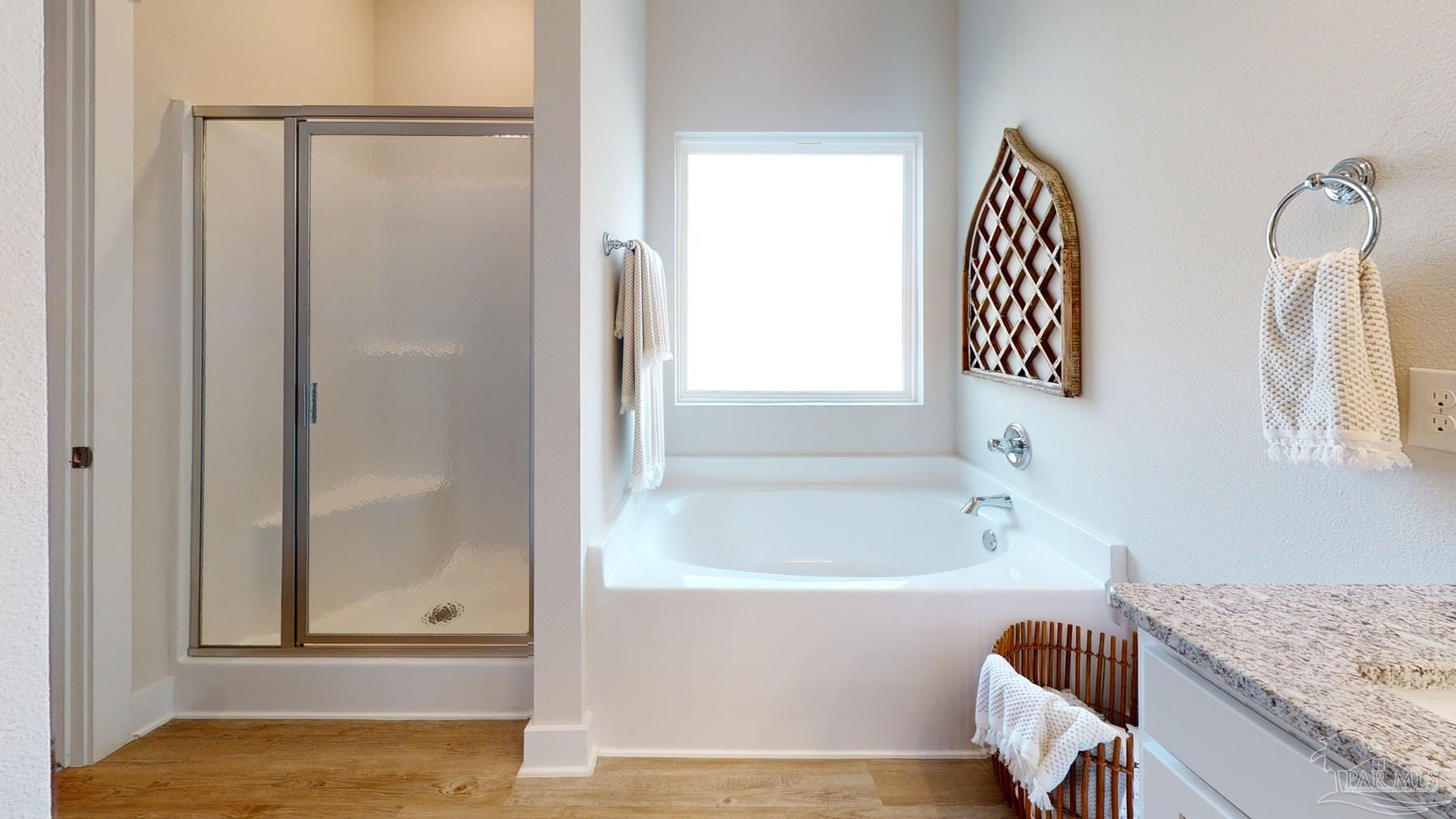 4531 Jude Way Pace, FL 32571 - Photo 25 of 43 a bathroom with a granite countertop bathtub and shower