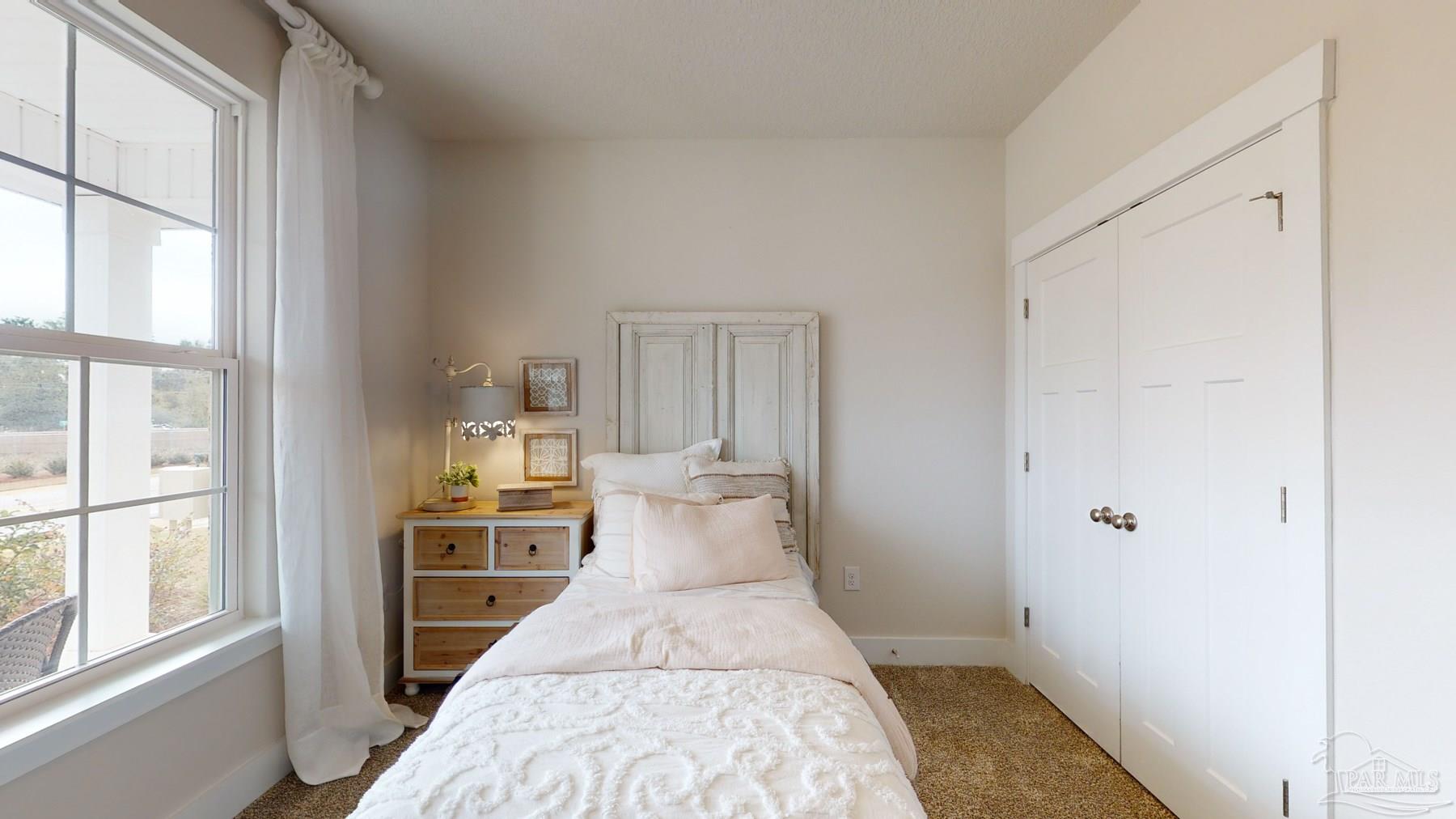 4531 Jude Way Pace, FL 32571 - Photo 32 of 43 a view of a bedroom with wooden floor
