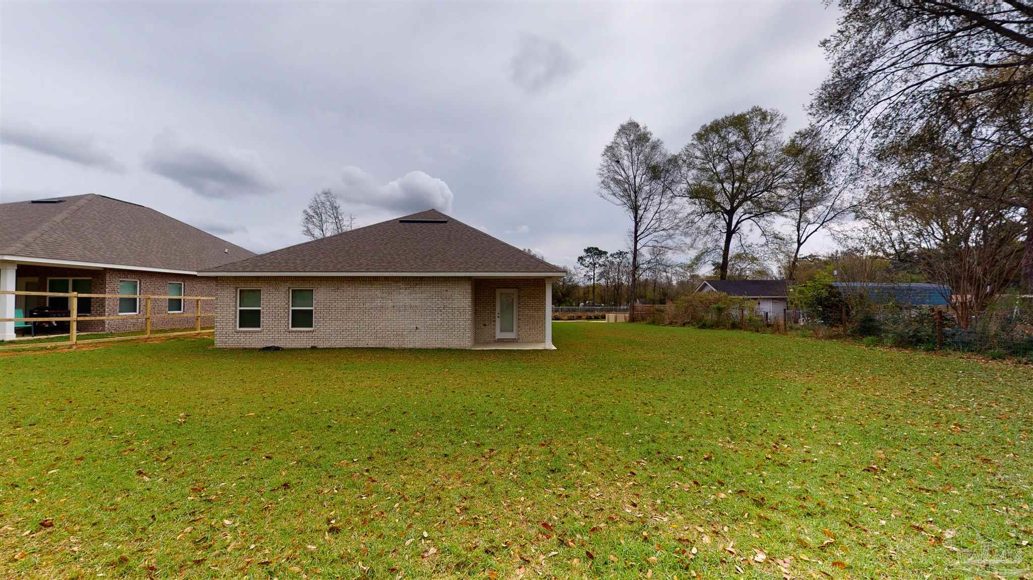 4531 Jude Way Pace, FL 32571 - Photo 40 of 43 a front view of a house with garden